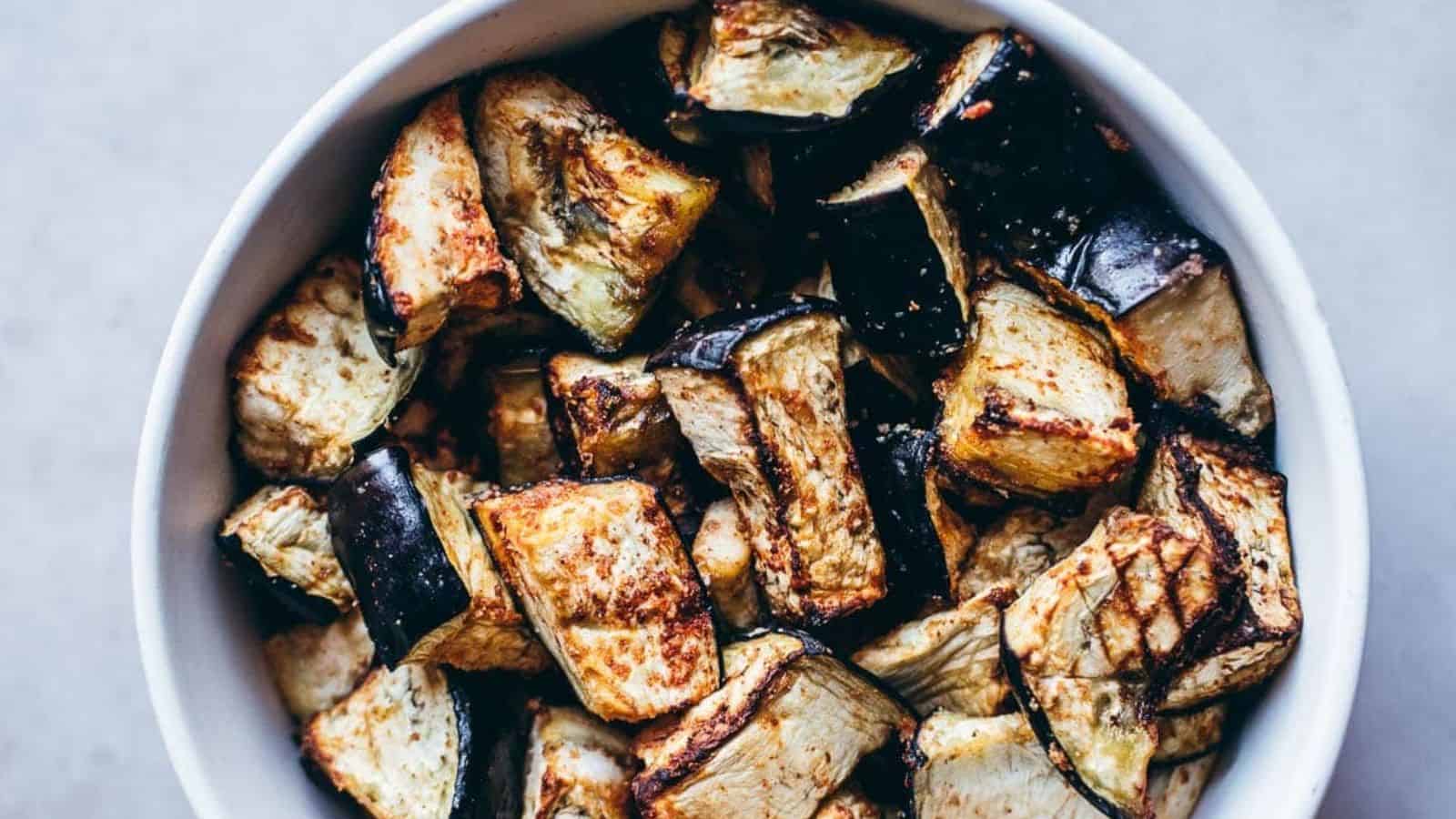 A bowl of delicious air fryer eggplant with spices.