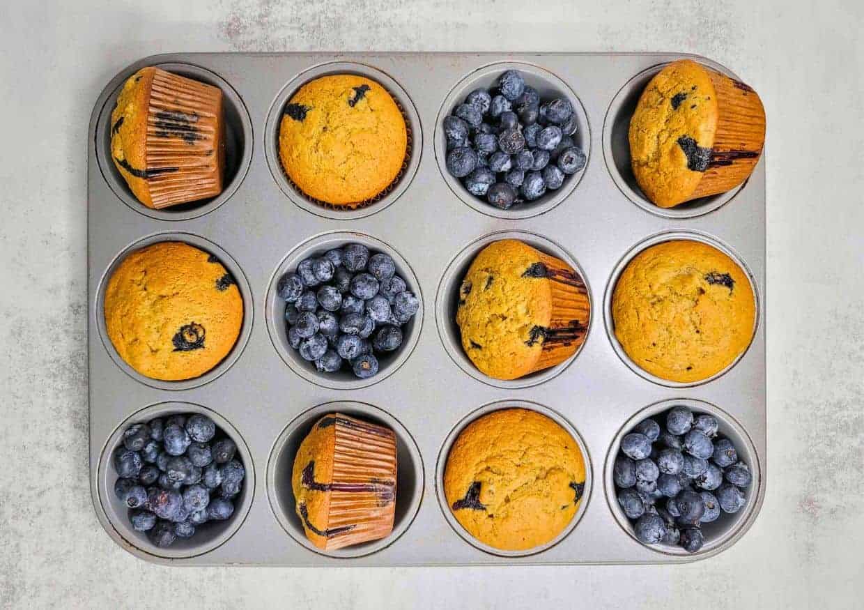 Blueberry muffins in a muffin tin.
