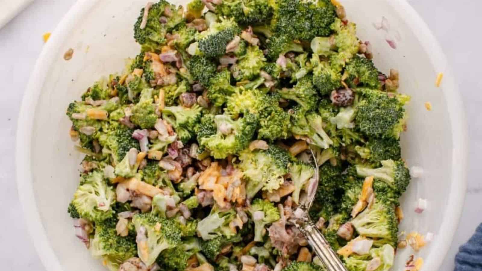 Top view of Broccoli Crunch Salad in a bowl with a spoon.