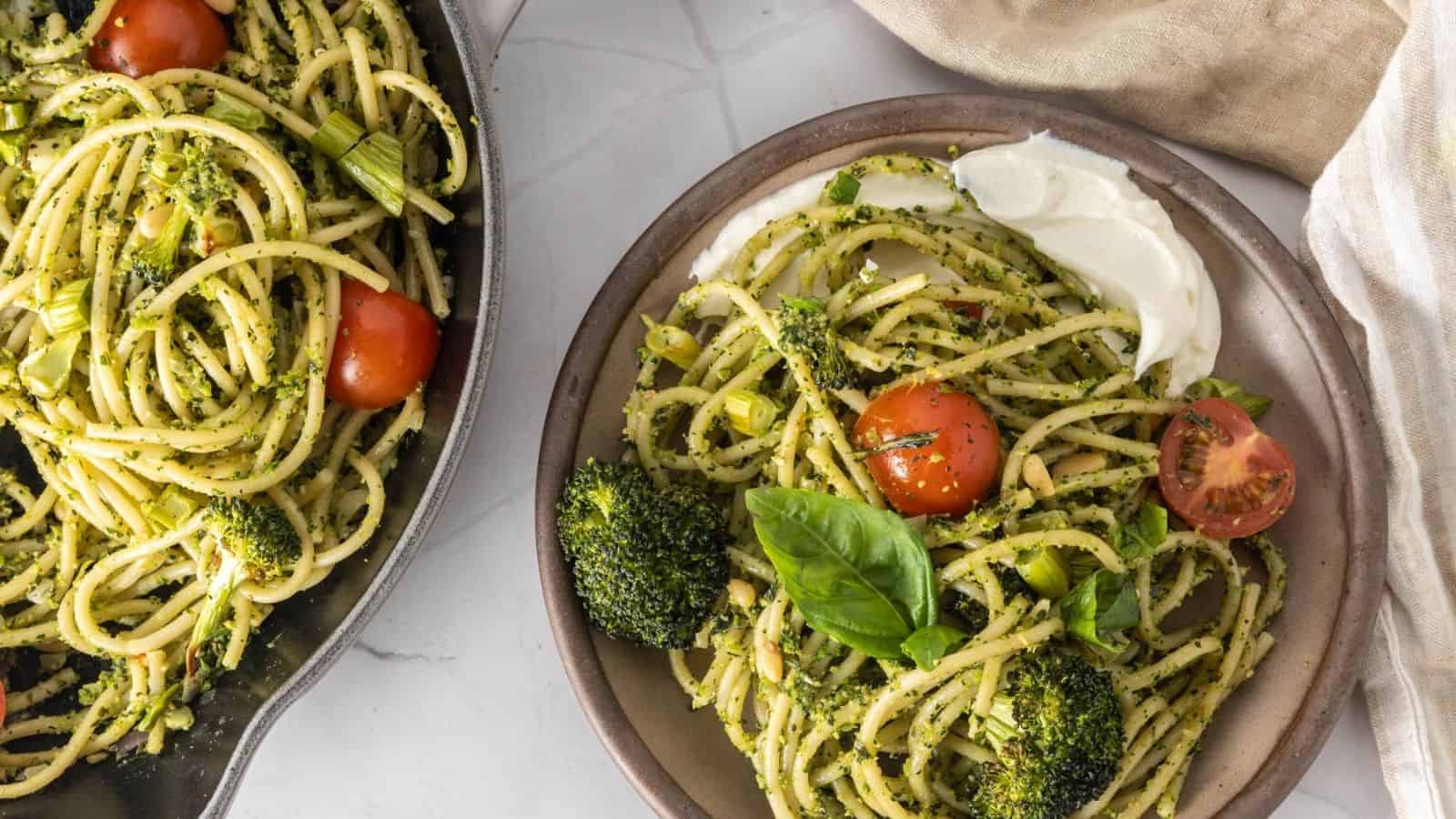 An overhead image of broccoli pesto pasta served in a plate.