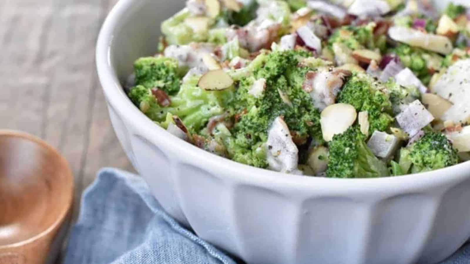 A bowl of broccoli salad with bacon.
