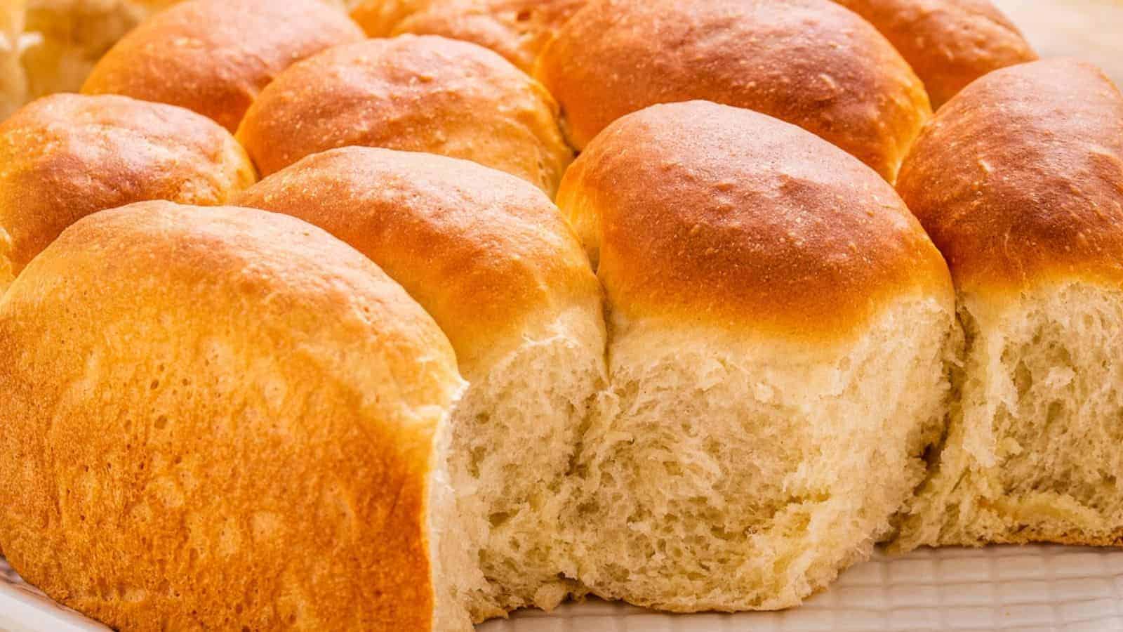 Close-up of a batch of a golden-brown dinner rolls.