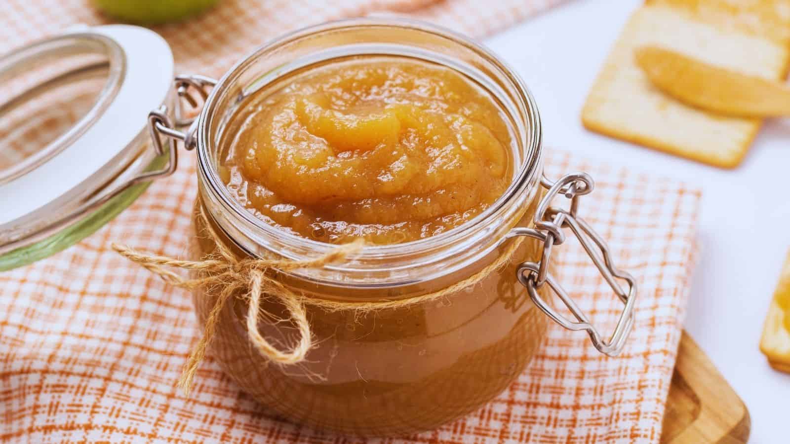 A close up photo of instant pot apple butter in a jar.