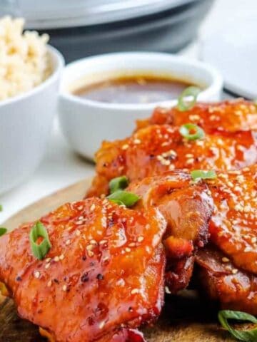 Instant Pot Honey Garlic Chicken on wooden cutting board.