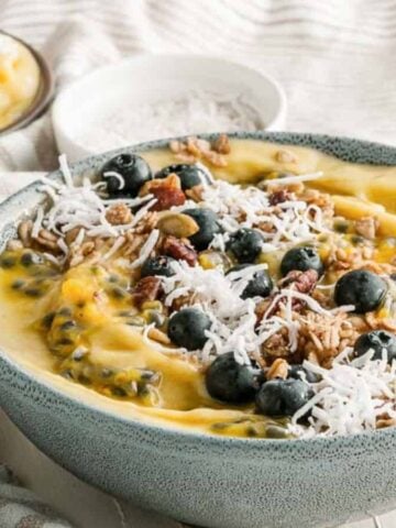 Close-up of mango banana smoothie bowl.
