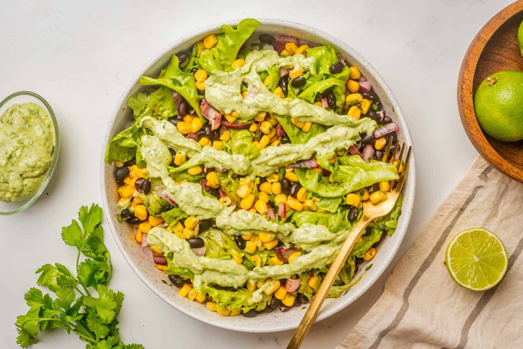 An overhead image of Mexican corn salad with the ingredients fully mixed together.