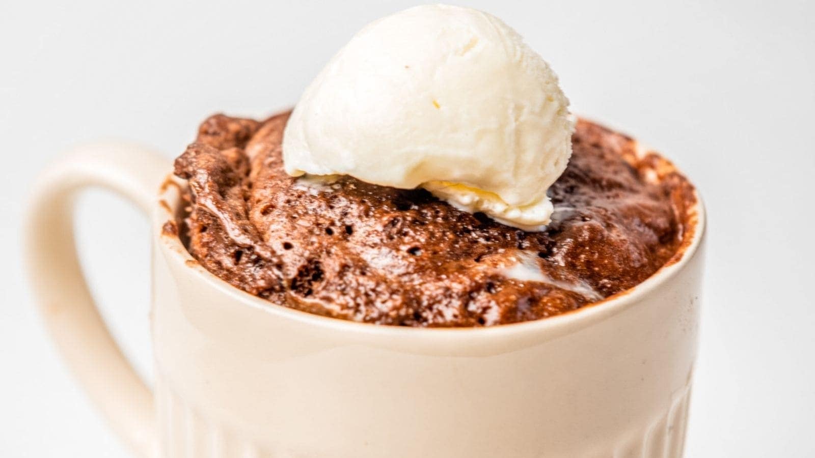 A close up photo of cooked microwave mug cake.