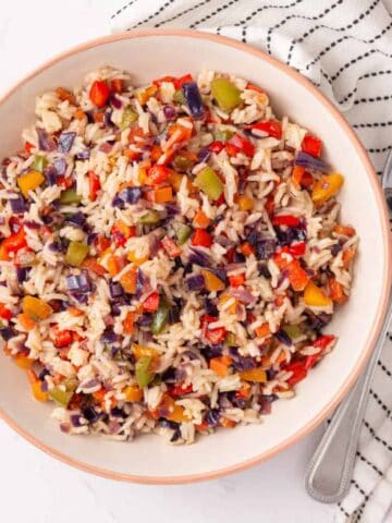 An overhead image of Nigerian fried rice in a serving bowl.