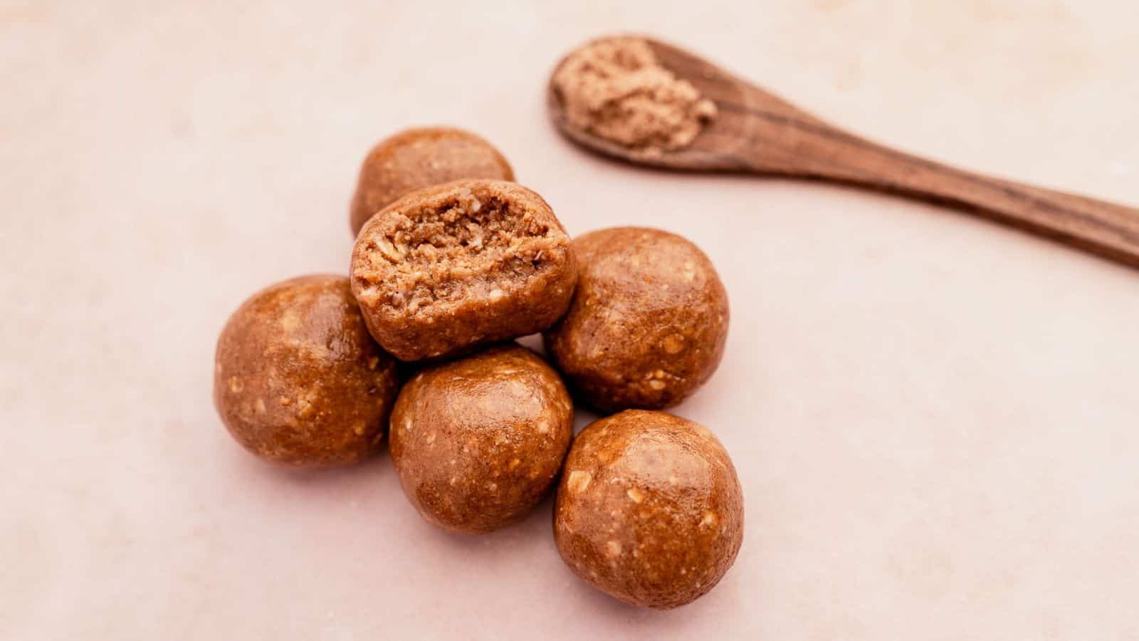 A close-up image of no bake maple tahini chai energy bites.