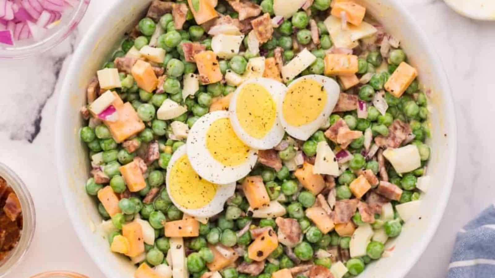 Close-up image of pea salad with eggs on a bowl.