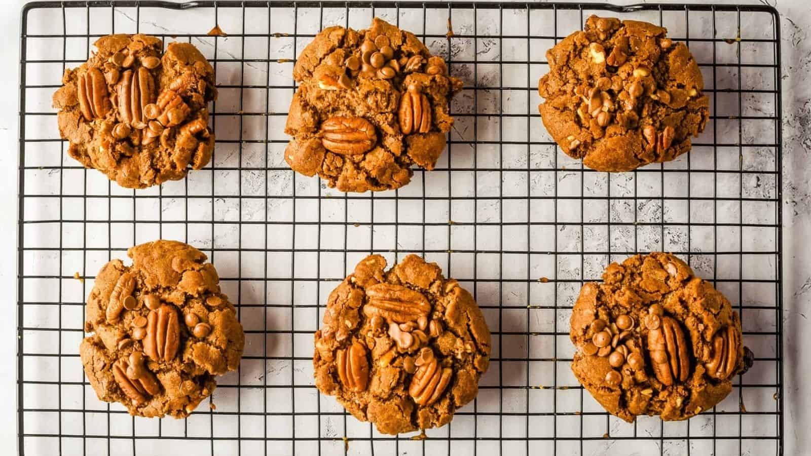 A close up photo of a stack of pecan chocolate chip cookies.