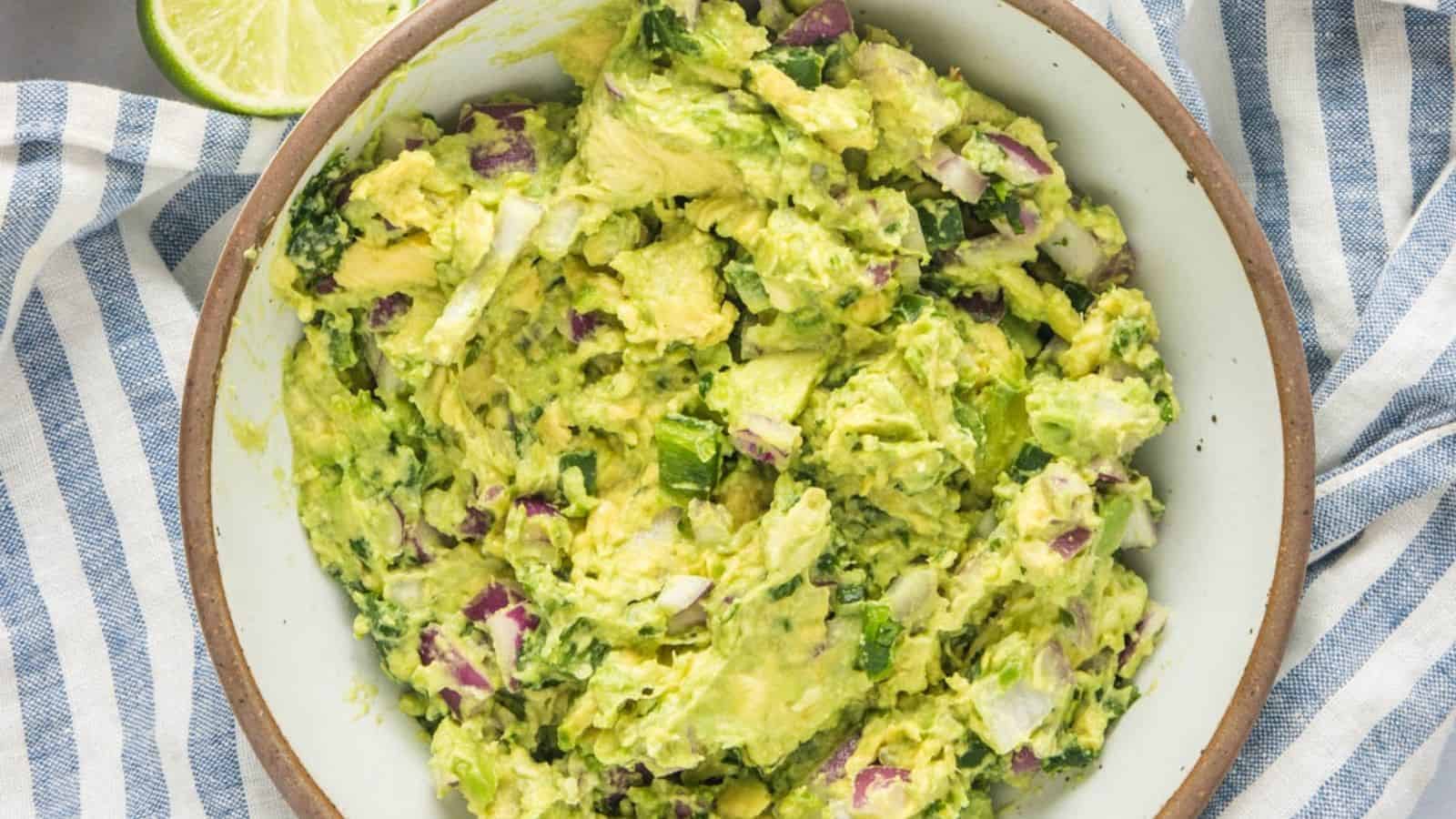 An overhead image of spicy guacamole in a bowl.