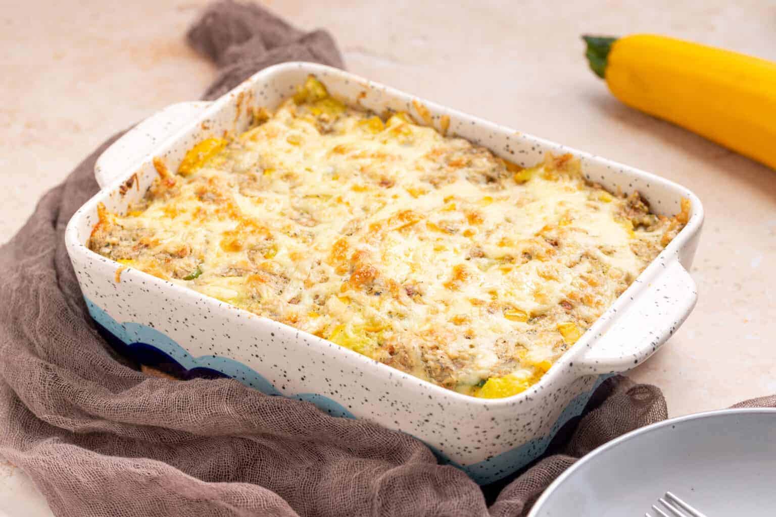 An image of Squash Casserole in a baking dish.