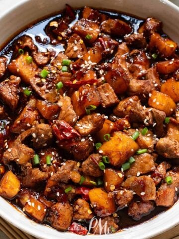 A white bowl with Stovetop Pineapple Pork Tenderloin in it.