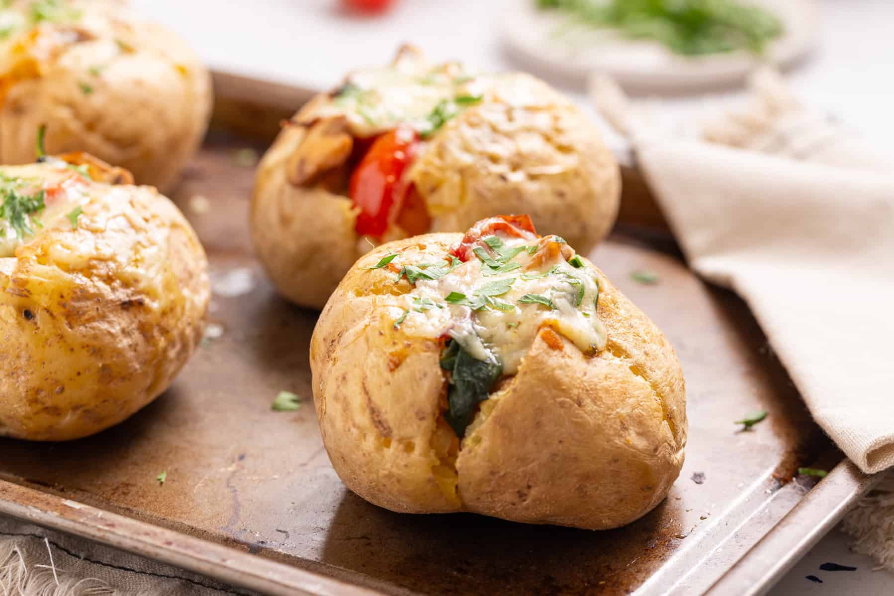 A close-up image of stuffed baked potatoes.