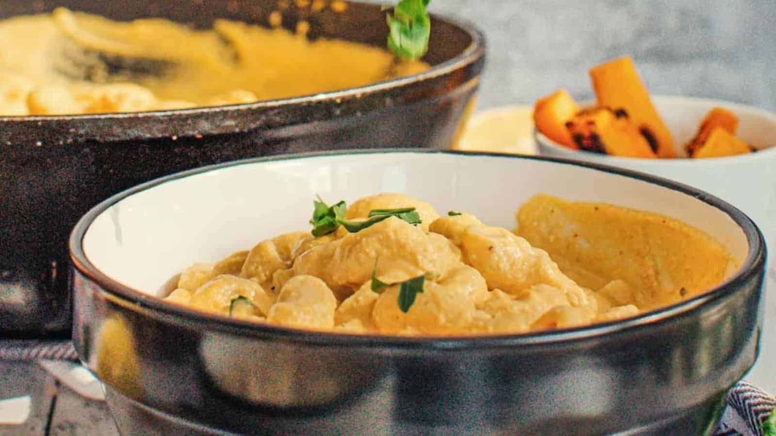 Close-up image of vegan pumpkin mac and cheese in a bowl.