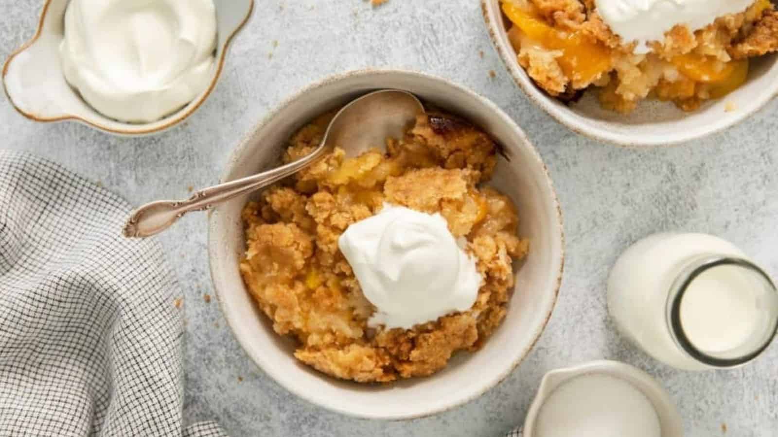 Top view of peach cobblerr in a bowl.