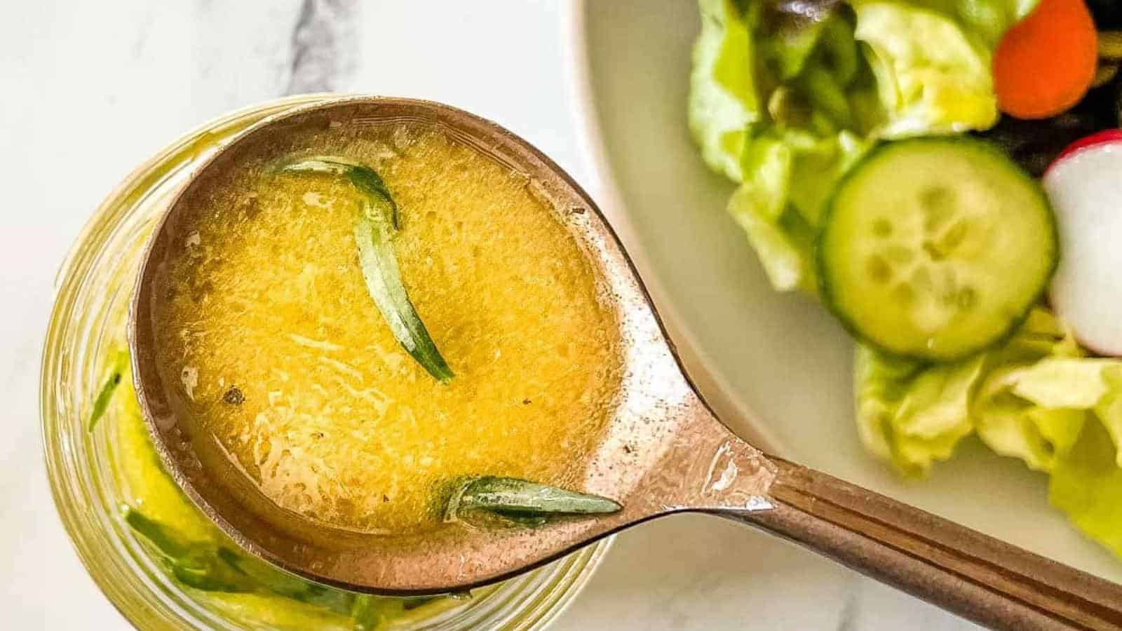 Lemon herb vinaigrette in a copper-colored spoon.