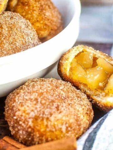 Apple pie bites cut open to show the apple filling inside.