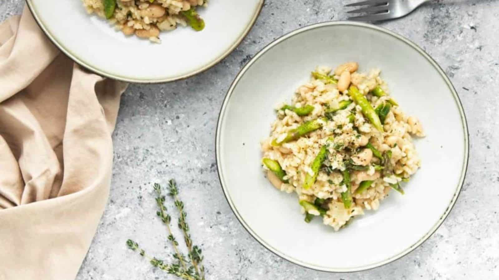 Overhead image of asparagus and white bean risotto in a plate.