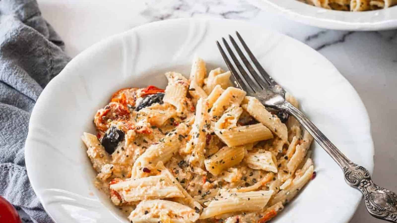 Side view of baked feta pasta on a plate.