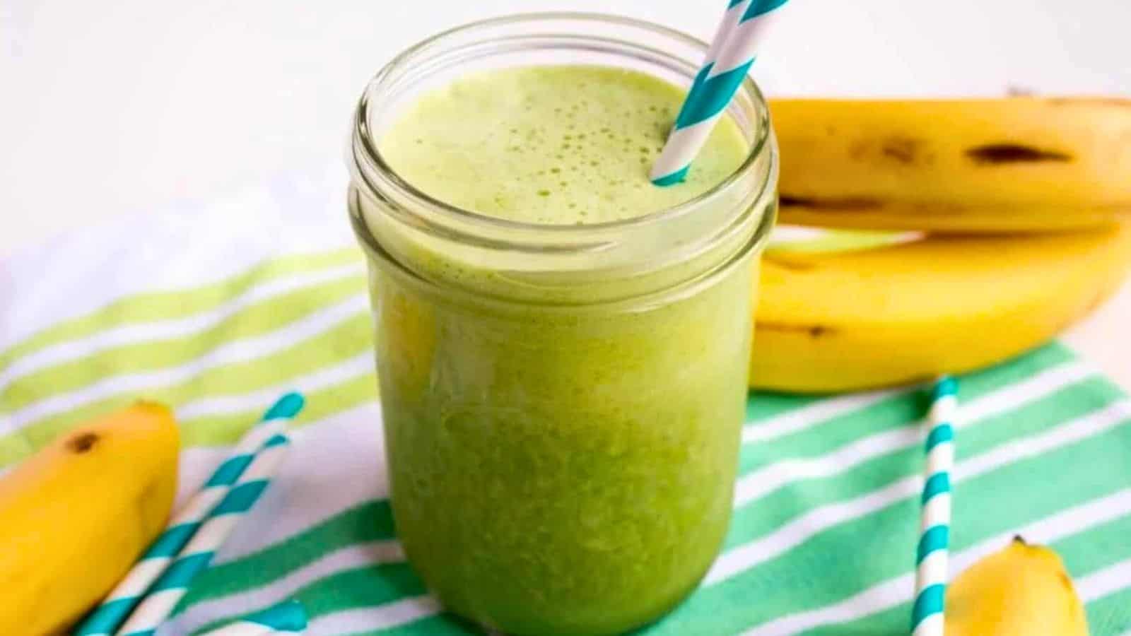 A green smoothie in a mason jar.