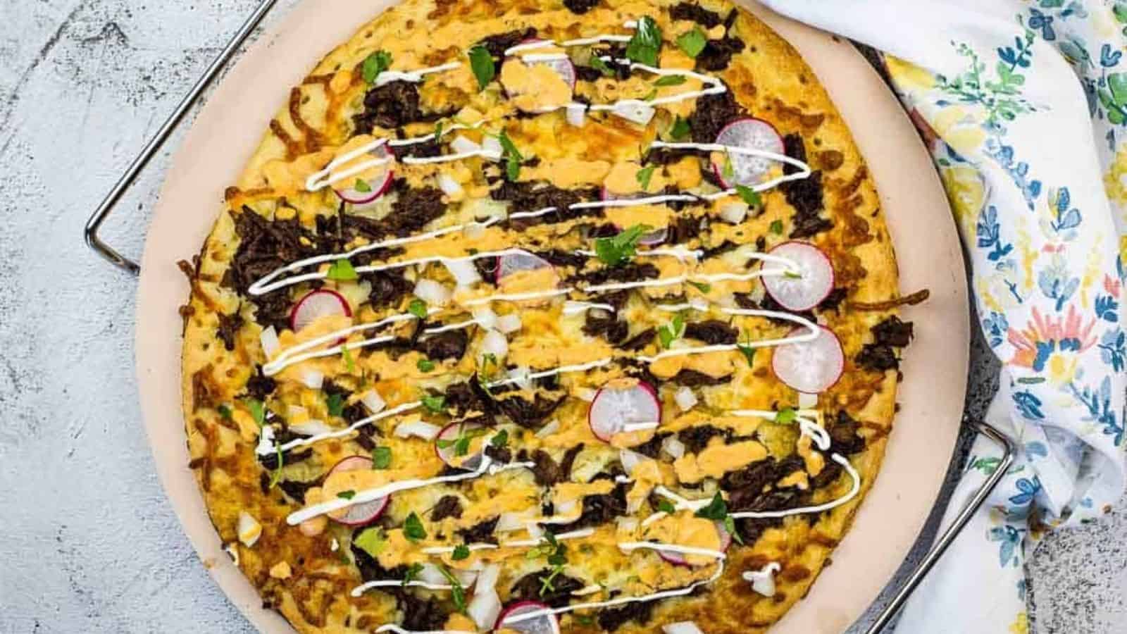 Birria Pizza on a pizza stone.