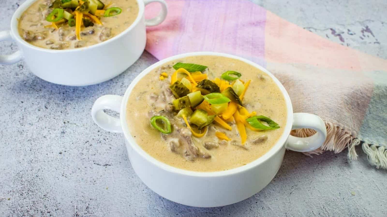 Cheeseburger soup in two serving bowls.