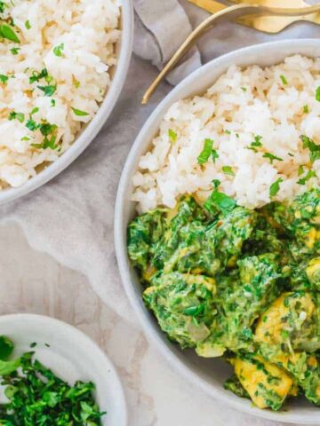 Two bowls of chicken saag.