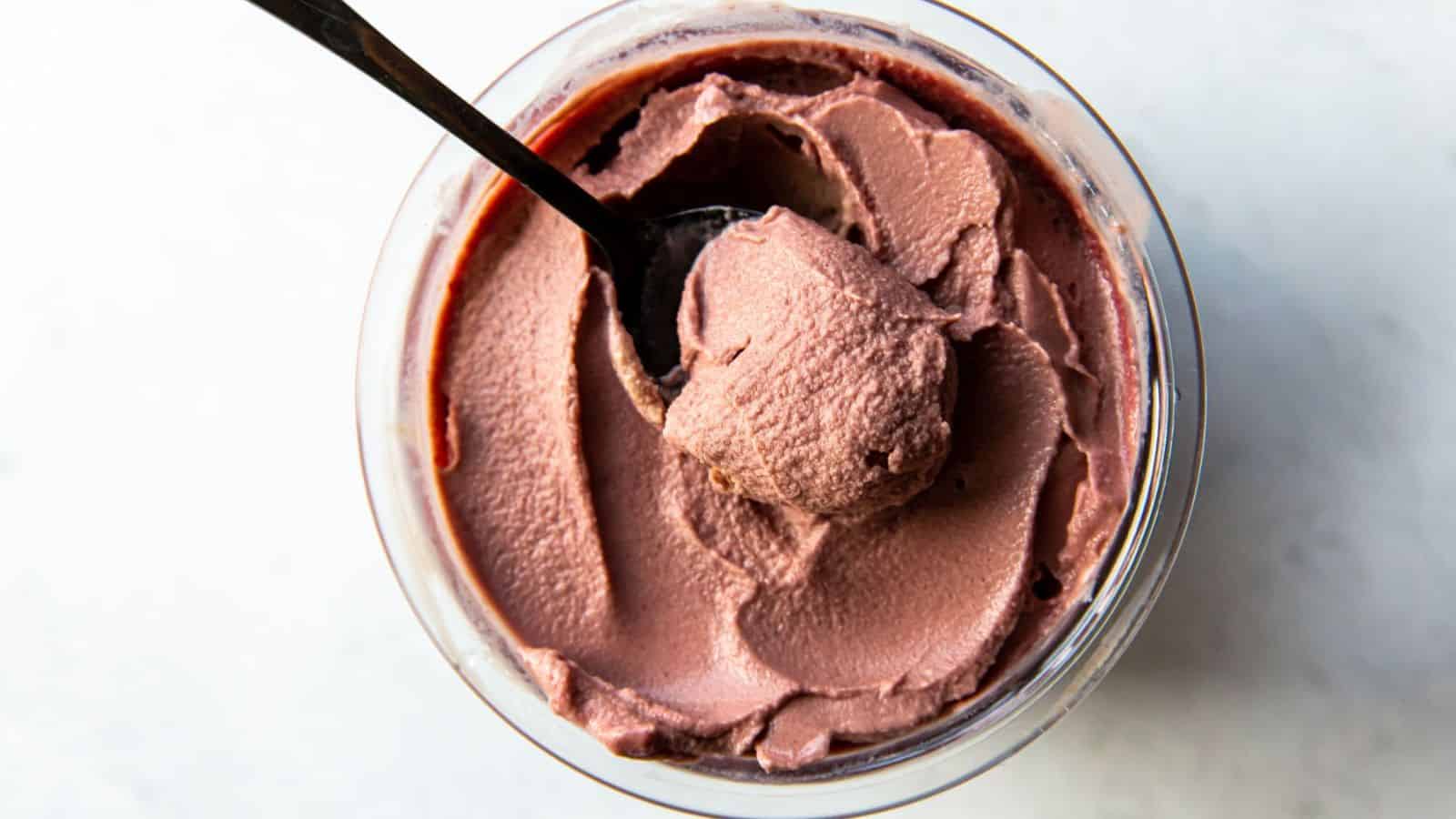 A close-up of a chocolate cherry protein ice cream.