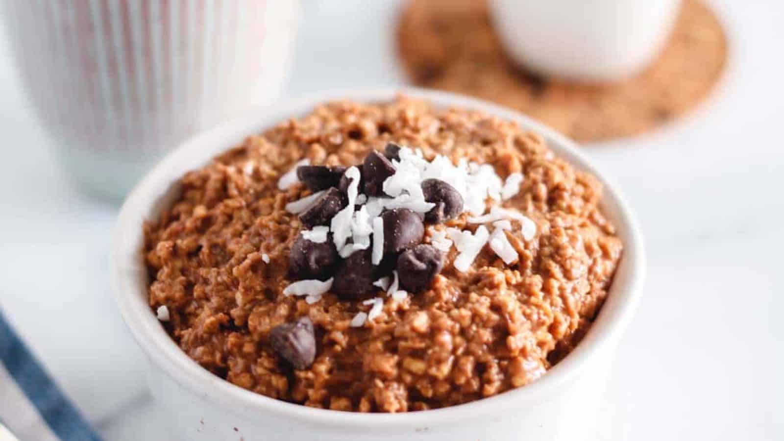 A bowl of chocolate overnight oats on a table.