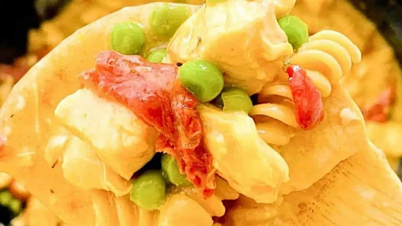 Chicken pasta with sundried tomatoes and peas and garlic..