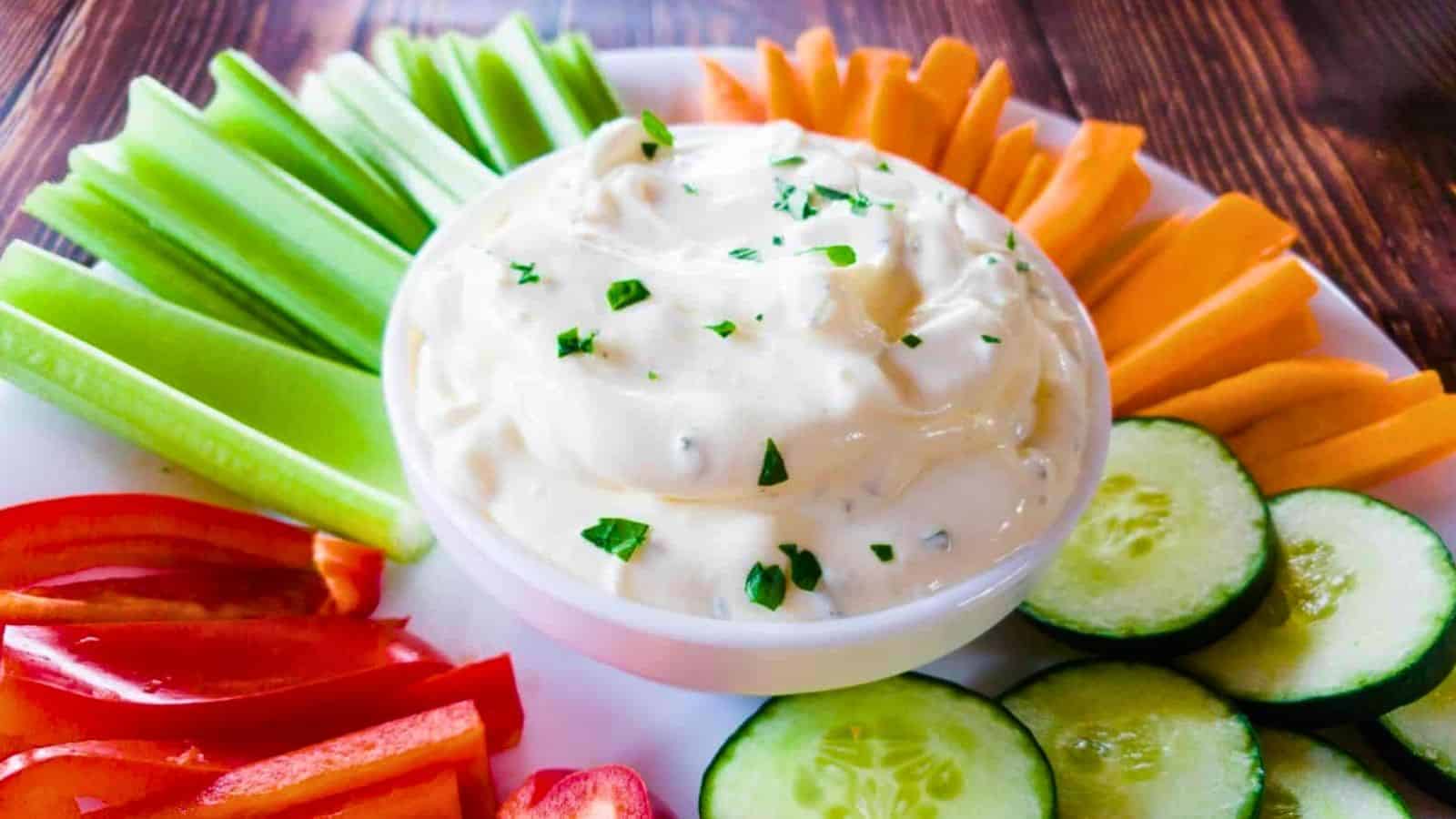 A picture of easy 3-Ingredient Onion Dip with vegetable sticks.