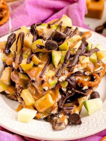 Close-up image of easy caramel pretzel apple bark in a plate.