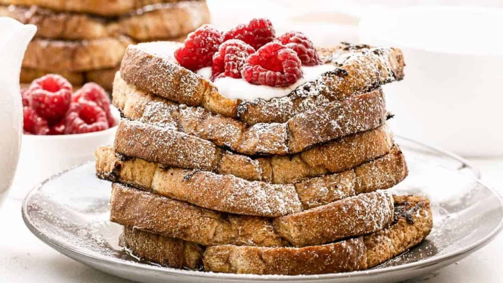 A stack of easy vegan french toast with toppings in a plate.