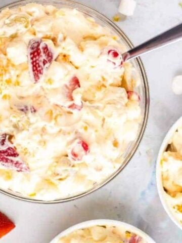 Bowls of fruit salad with cool whip.