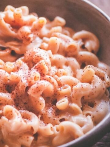 Instant pot chipotle mac and cheese with a spoon in a bowl.