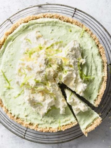 Whole keto key lime pie on a counter.