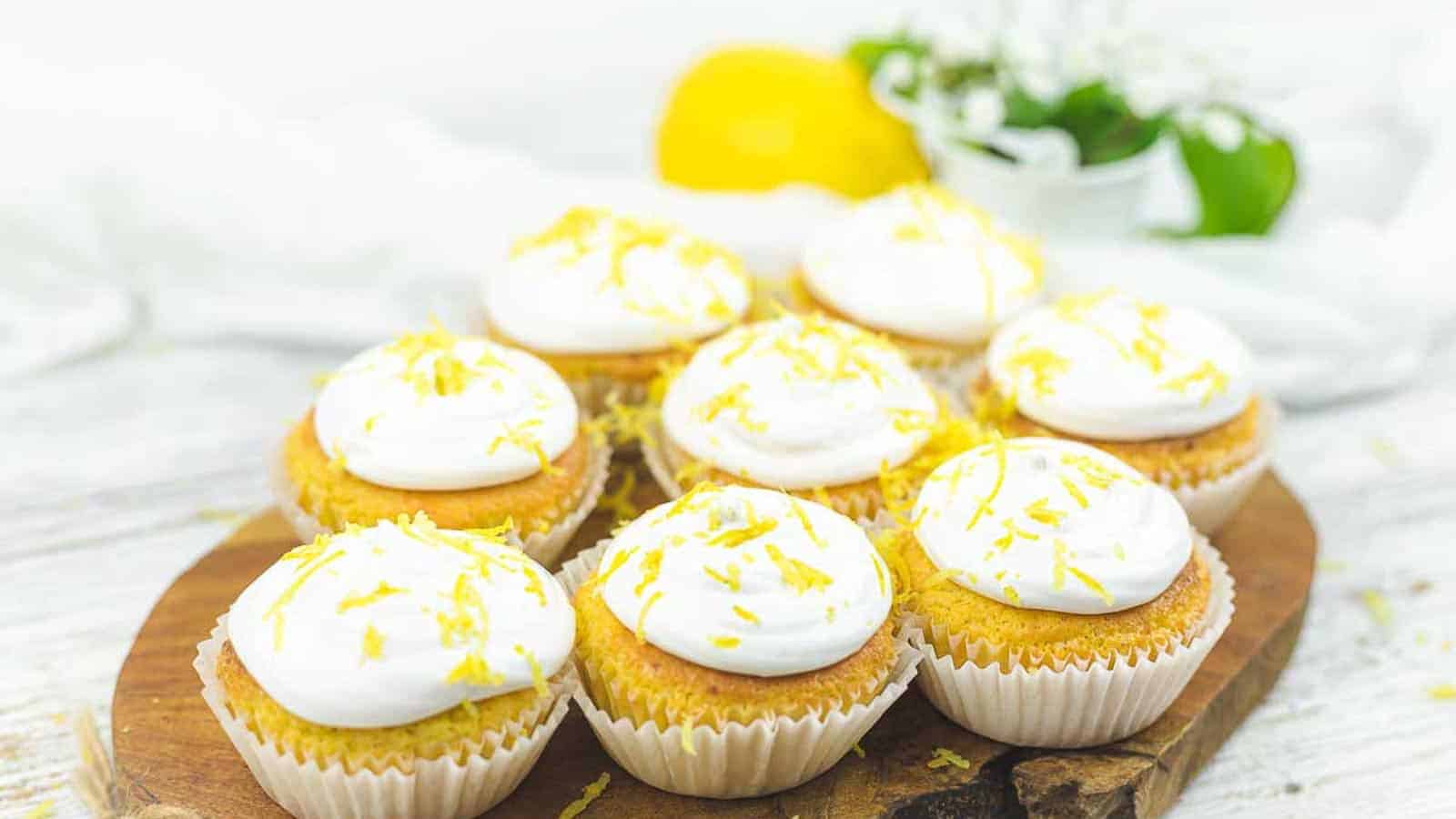 Meringue Lemon Curd Cupcakes on a wooden board.