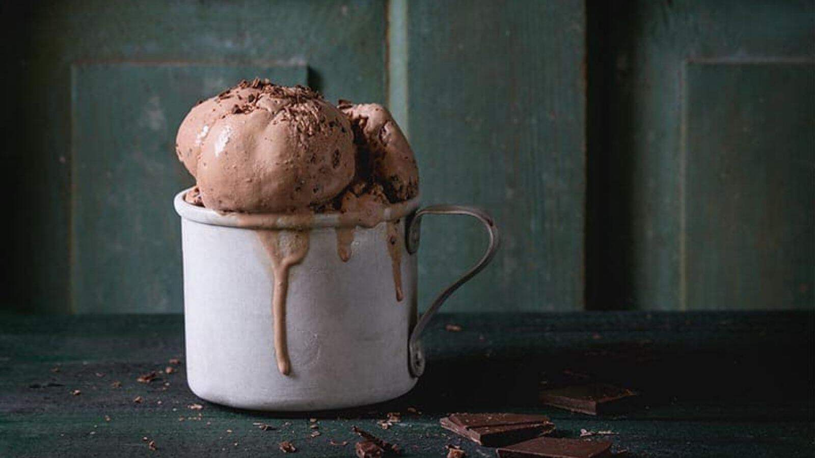 Chocolate Mason Jar Ice Cream overflowing a tin mug and dripping over.