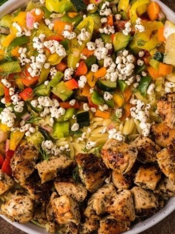 Ovehead image of mediterranean chicken orzo bowl.