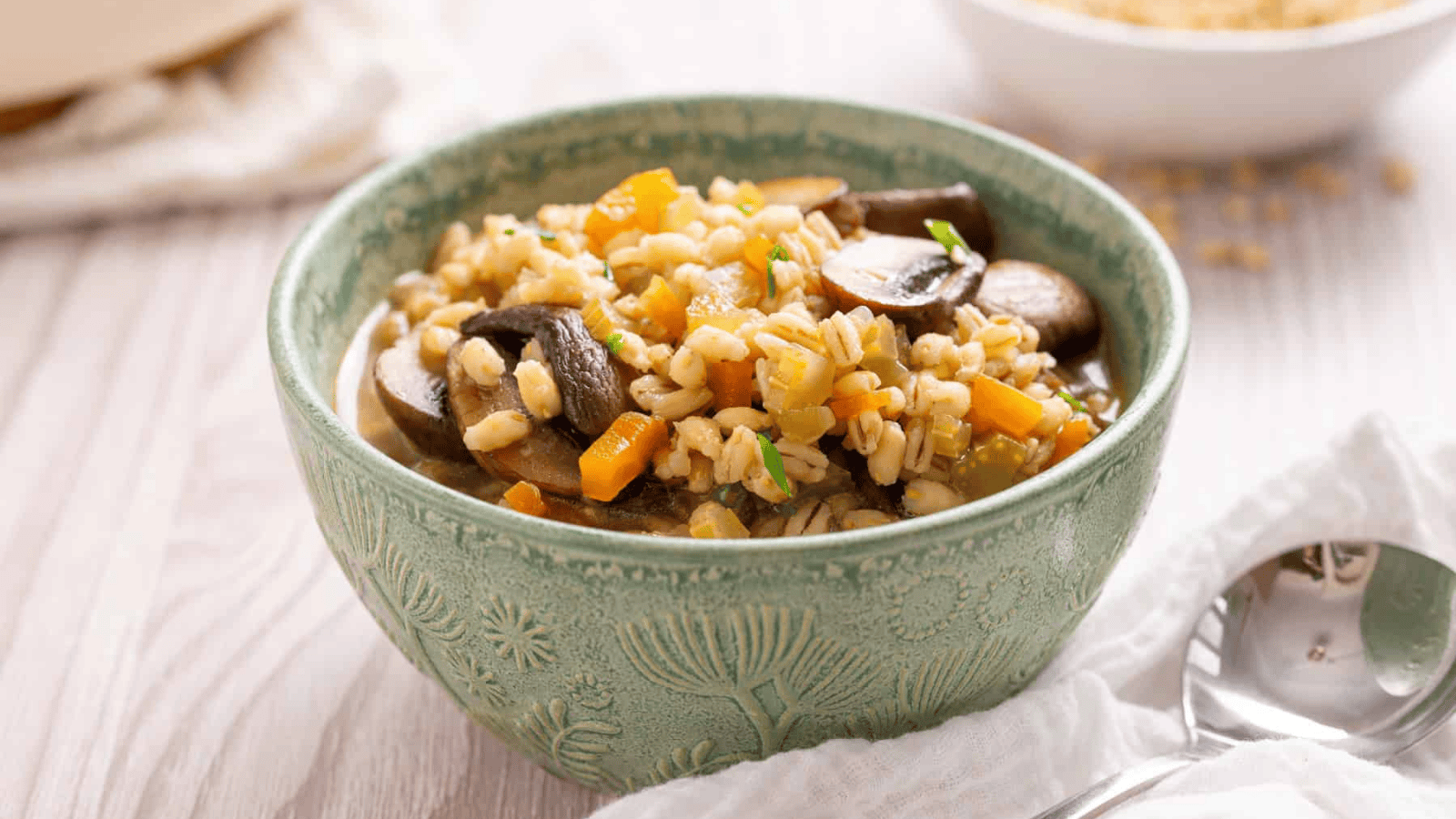 An image of mushroom barley soup in a bowl.