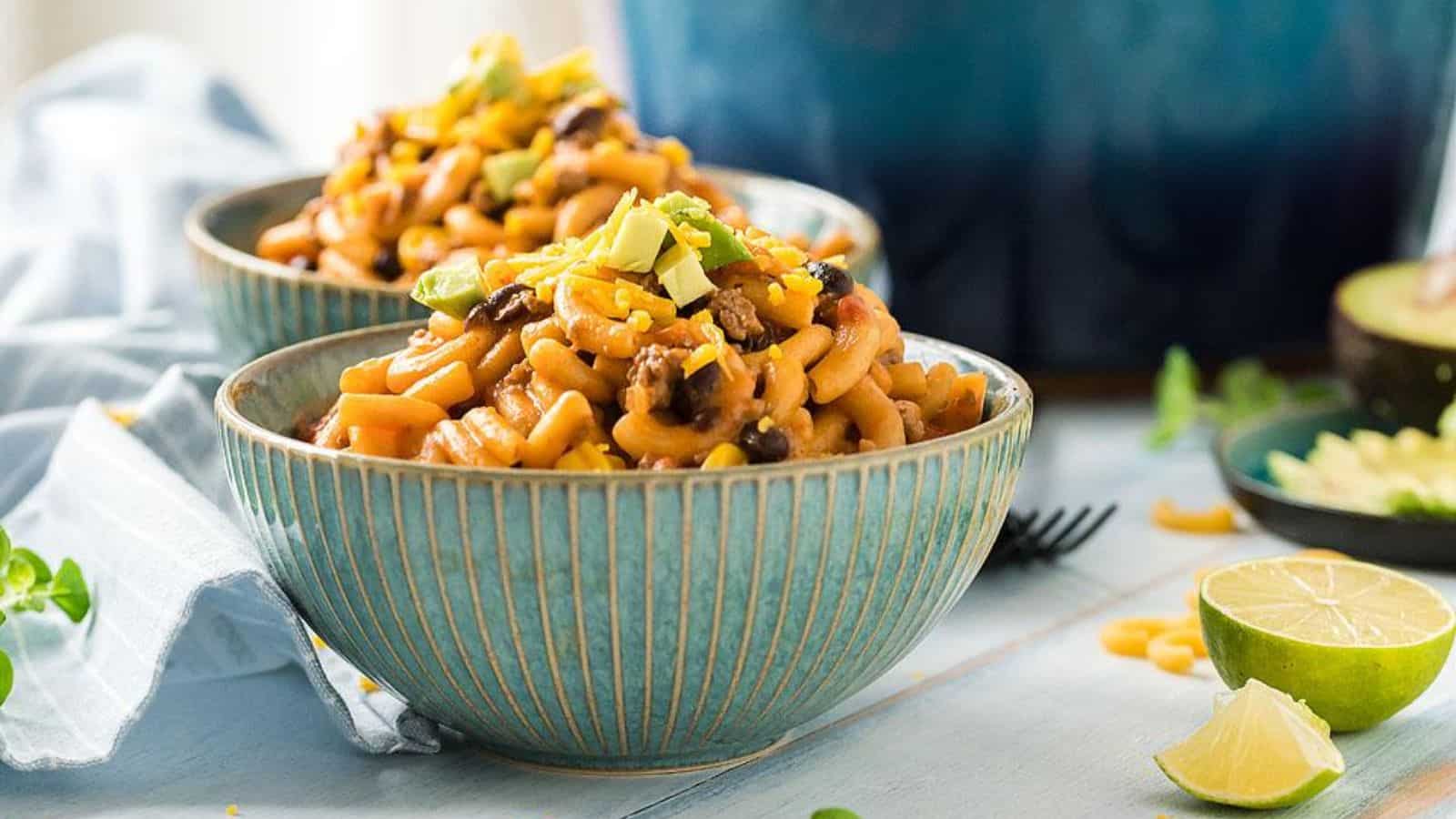 Two bowls of one pot cheesy taco pasta.