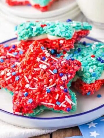 A batch of patriotic rice crispy treats on a white plate.