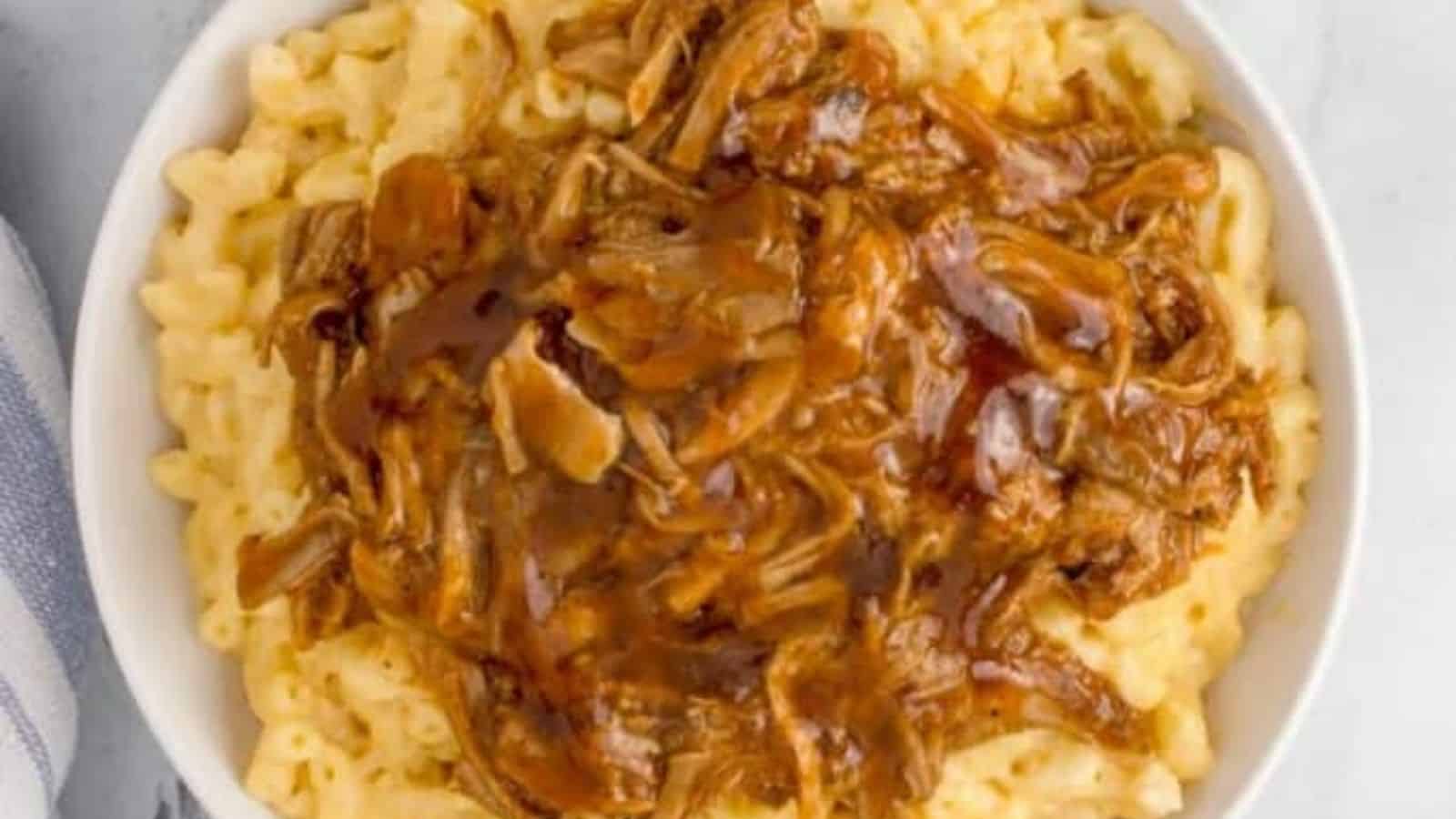 Overhead image of pulled pork mac and cheese in a bowl.