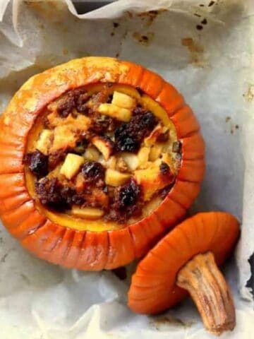 A pumpkin stuffed and bakked in a pan.