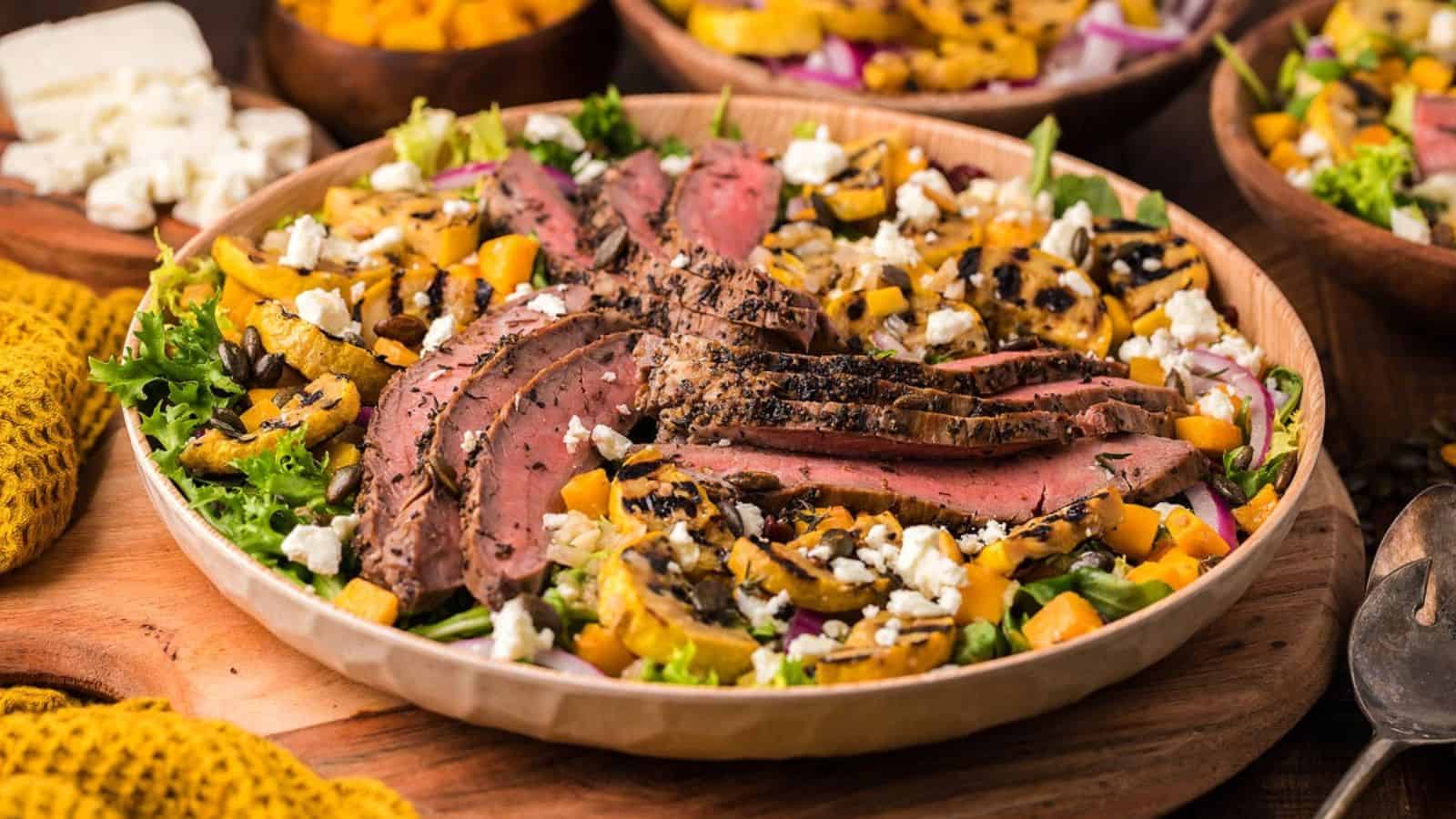 A plate of savory steak and squash salad.