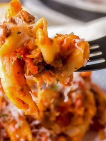 Slow Cooker Cheesy Penne with meat sauce and parmesan cheese.