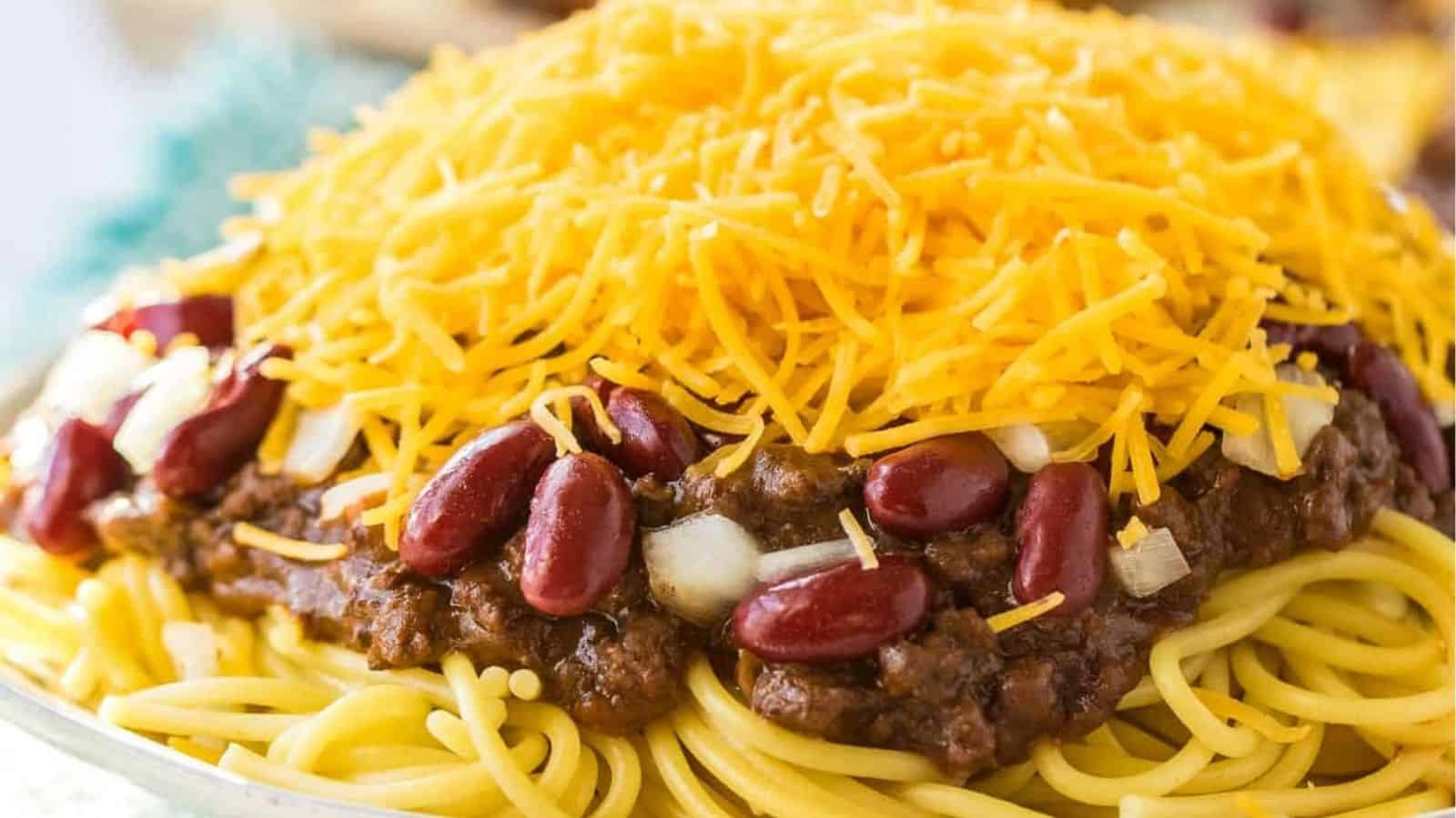 Cincinnatti chili on top of spaghetti and covered with cheese, beans and onions.