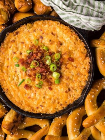 An image of smoked gouda bacon cheddar cheese dip for pretzels.